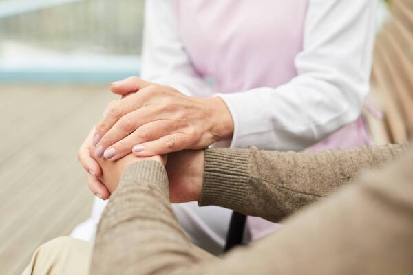 Caregiver supporting patient